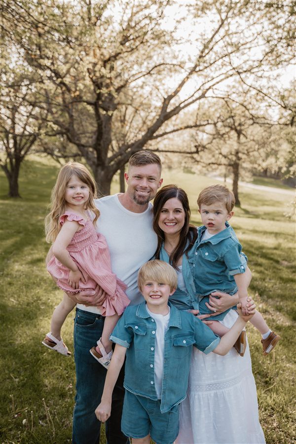 Zach Axelson with his wife and children