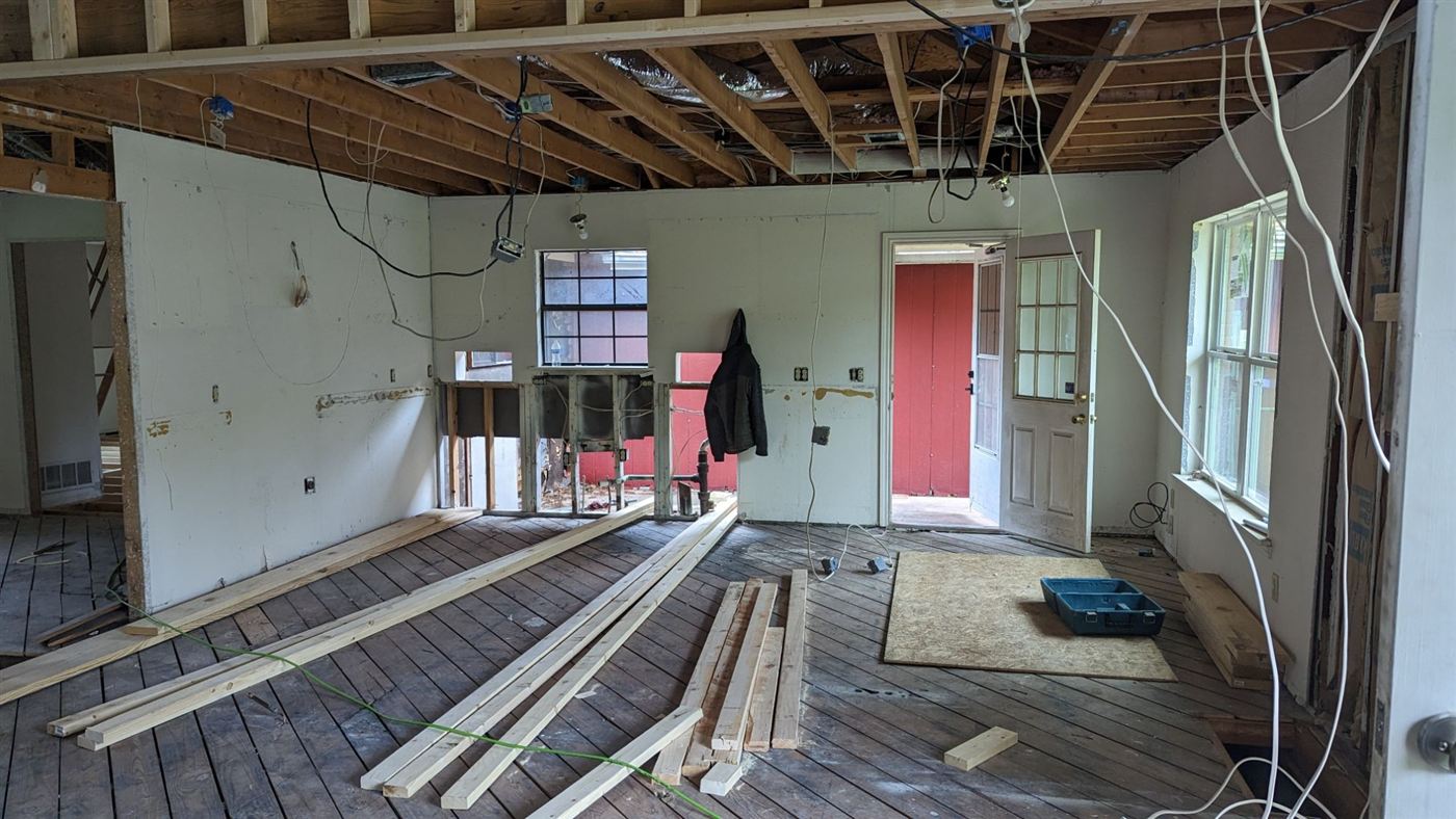 Kitchen and great room reframed down to the studs during the backsplash project