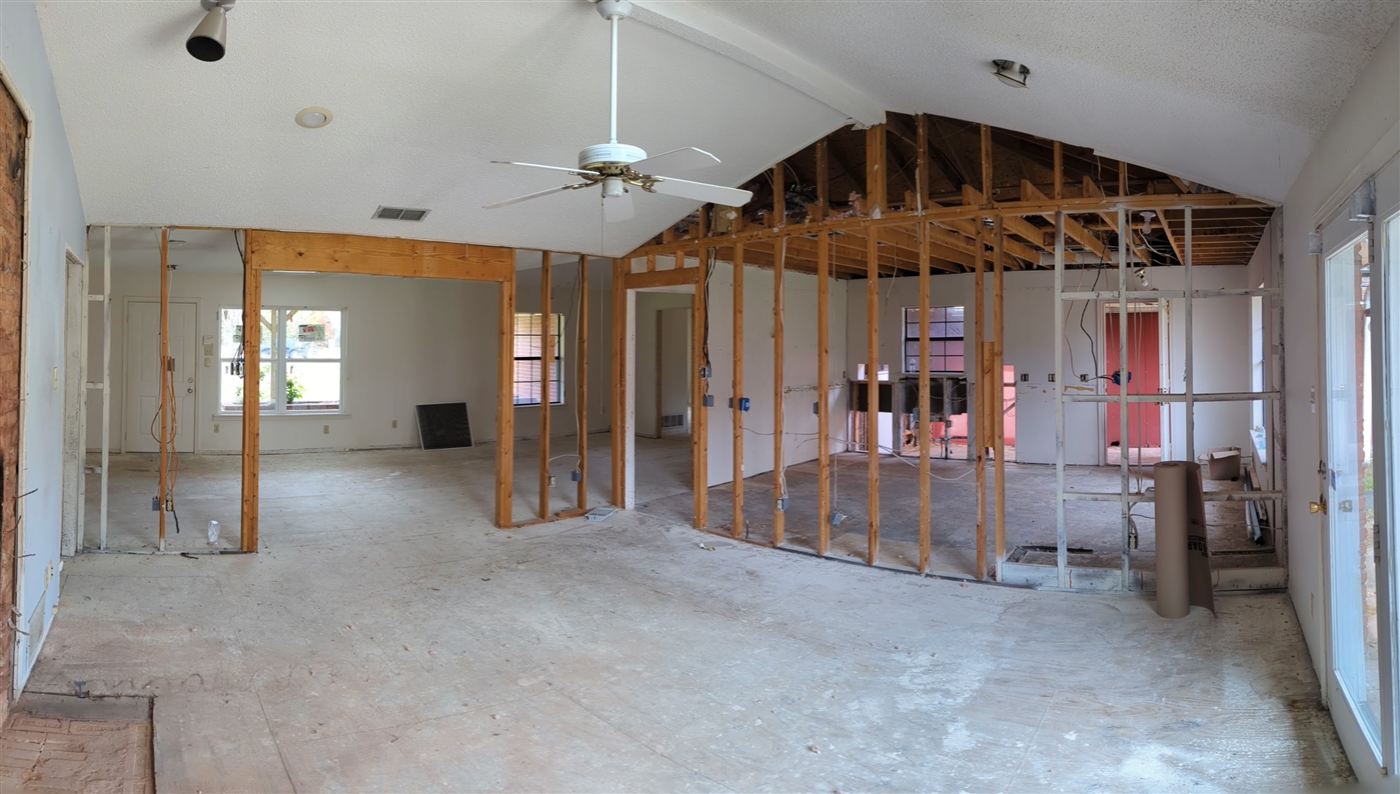 Kitchen and great room before renovation, showing original layout