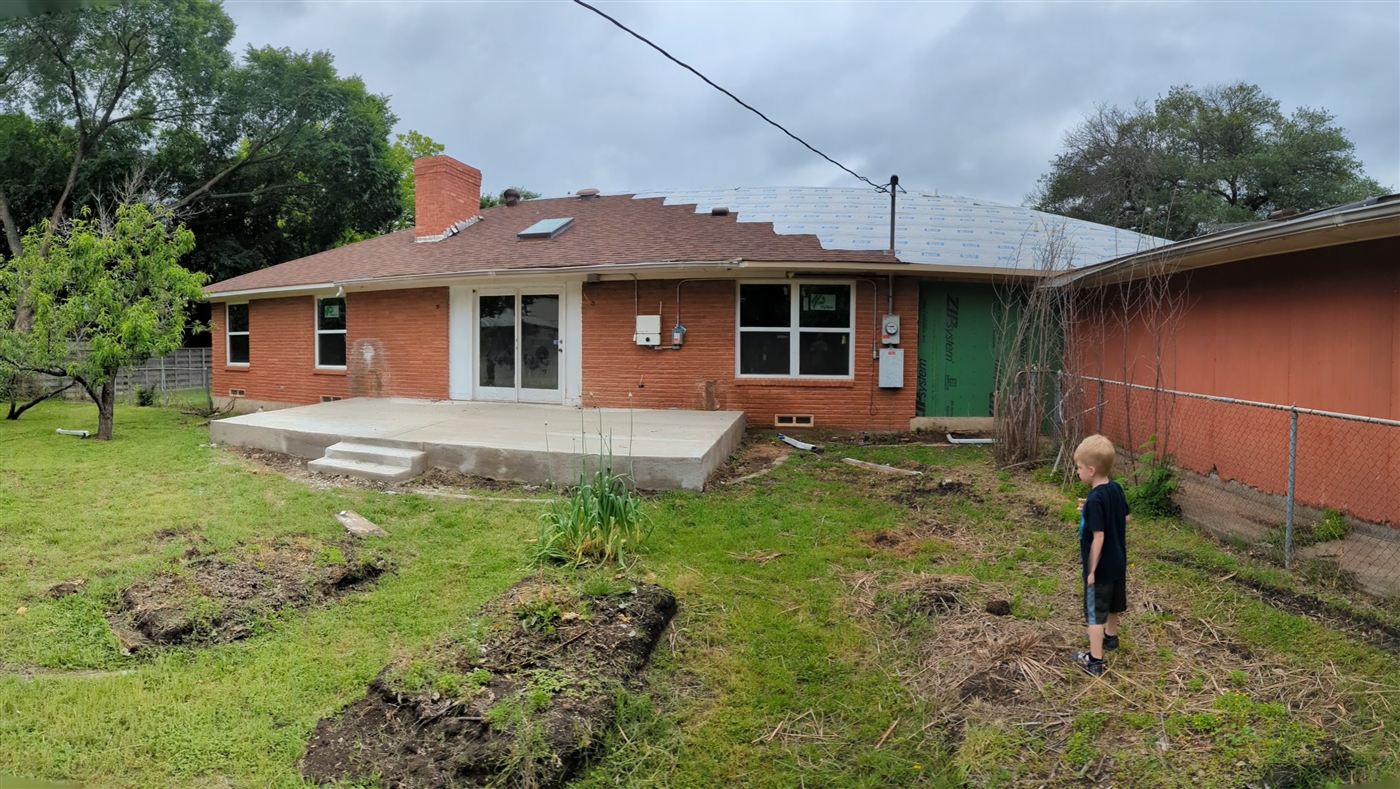 Bare concrete patio slab before covered structure was built